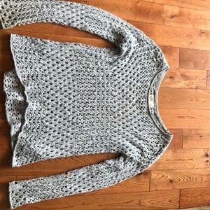 Cute peekaboo sweater, looks great with a bralette